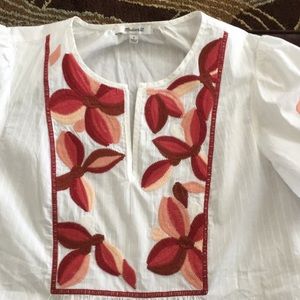 White top with embroidery design